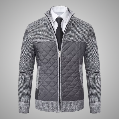 Gray quilted jacket with a zipper on a gray background