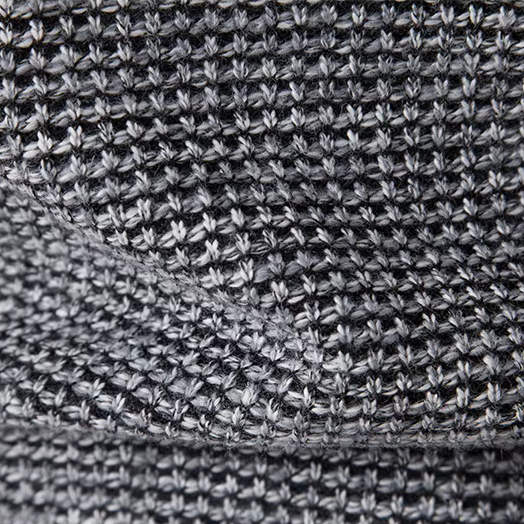 Close-up of a textured gray fabric with a subtle pattern