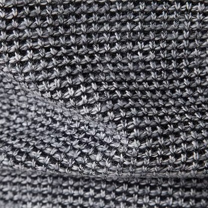 Close-up of a textured gray fabric with a subtle pattern