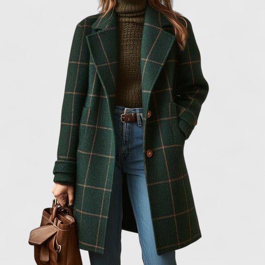 Person wearing a green plaid coat with a brown bag on a white background