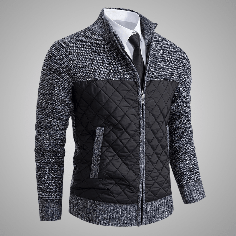 Gray and black quilted jacket on a gray background
