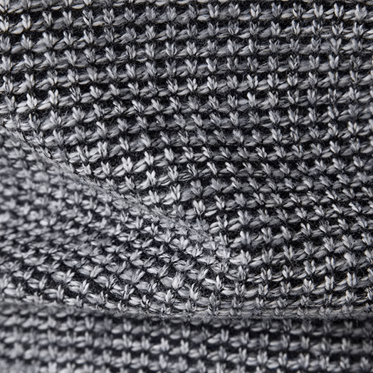 Close-up of a textured gray fabric with a subtle pattern