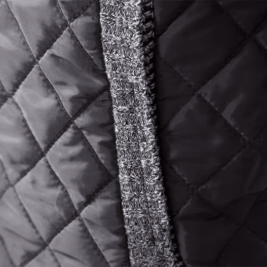 Close-up of quilted fabric with a textured stripe