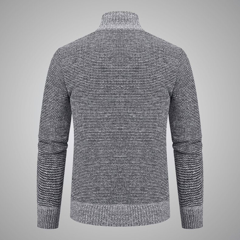 Gray knitted sweater on a gray background