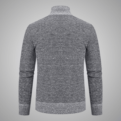 Gray knitted sweater on a gray background