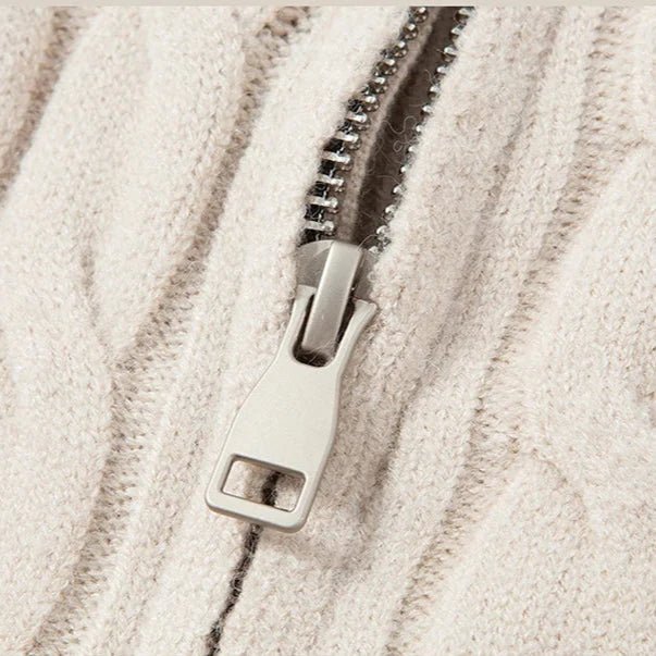 Close-up of a zipper on a textured beige fabric background