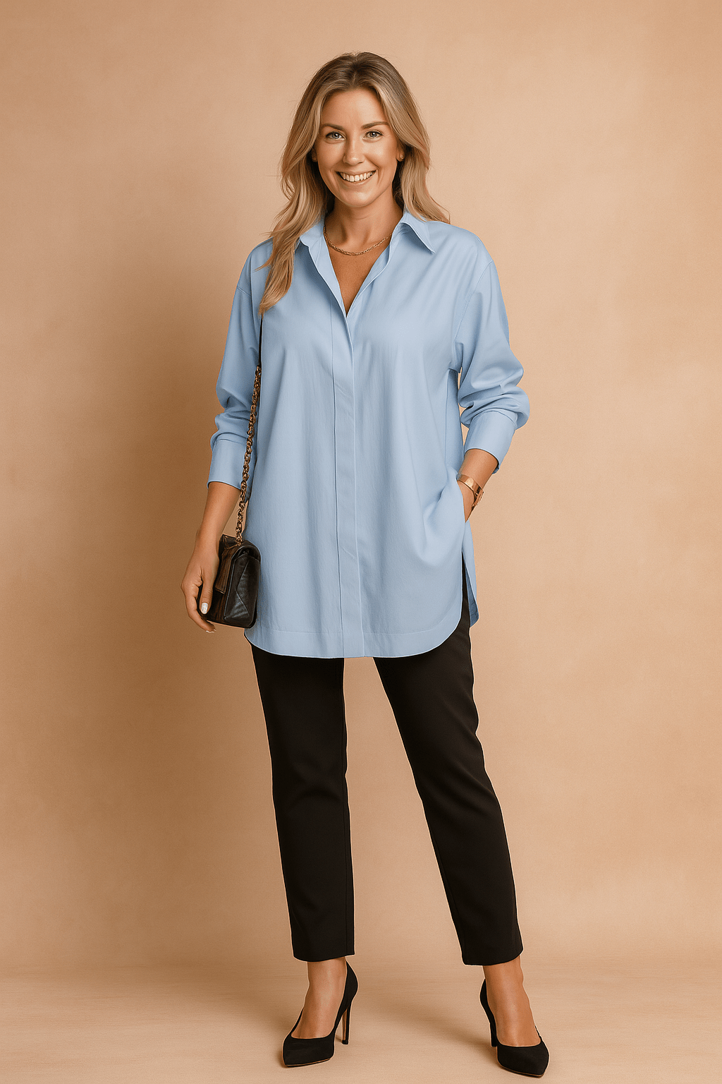 Woman wearing a light blue shirt and black pants against a beige background