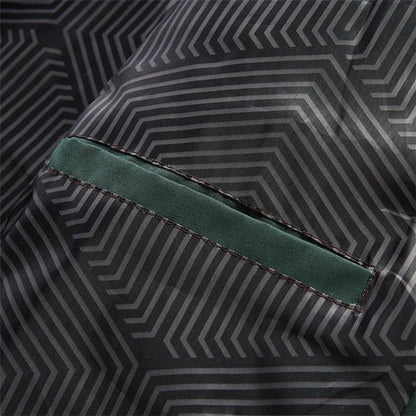 Close-up of a geometric patterned fabric with a green seam.