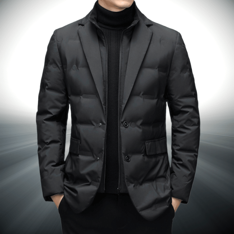 Black puffer jacket worn by a person on a gray background