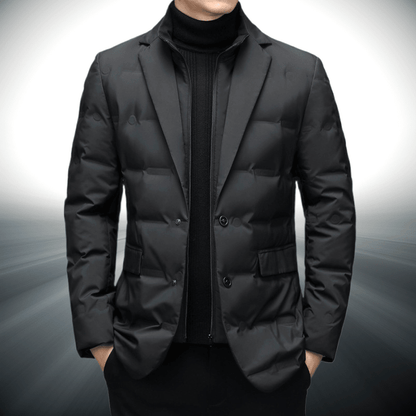 Black puffer jacket worn by a person on a gray background