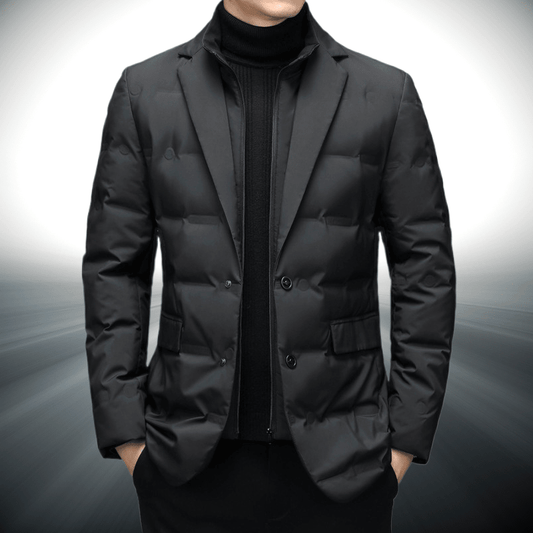 Black puffer jacket worn by a person on a gray background