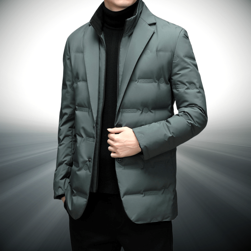 Person wearing a green puffer jacket on a gray background