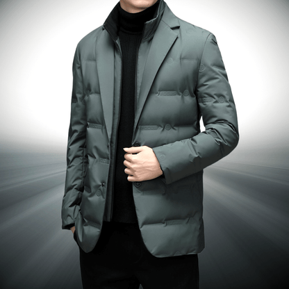Person wearing a green puffer jacket on a gray background