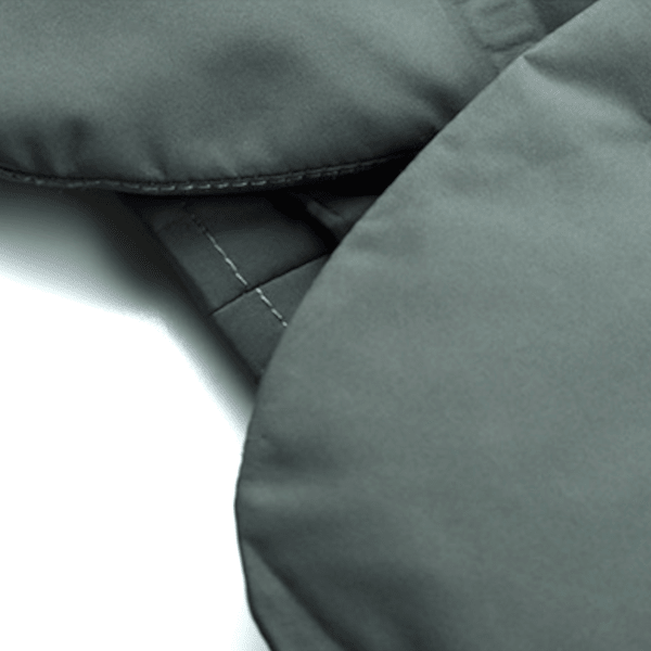 Close-up of a gray fabric surface with stitching details