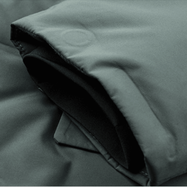 Close-up of a dark green fabric with a subtle pattern