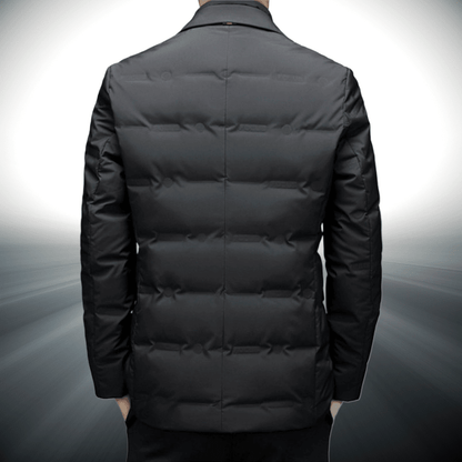 Black puffer jacket on a gray background