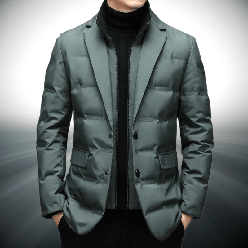 Green puffer jacket worn by a person on a gray background