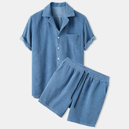 Blue striped pajama set on a light gray background