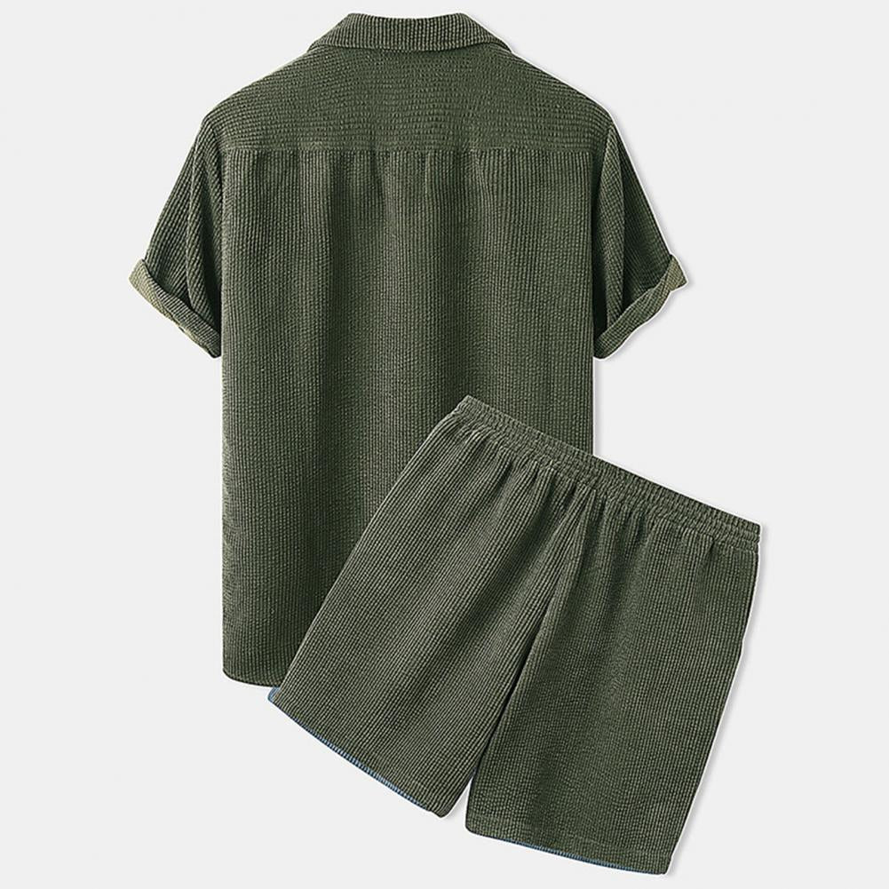 Green checkered shirt and shorts set on a light gray background