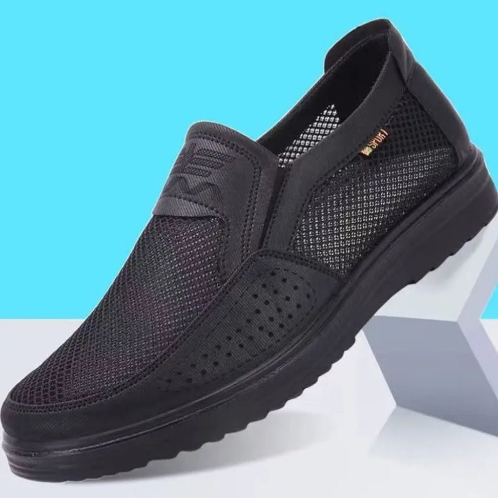 Black mesh shoe on a blue and gray geometric background