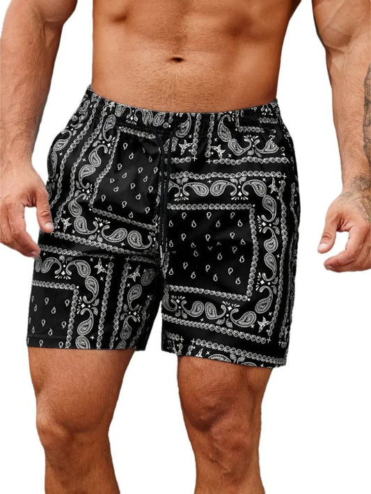 Black and white patterned shorts worn by a person on a plain background