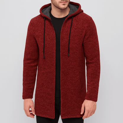 Red hooded coat worn by a person on a light gray background