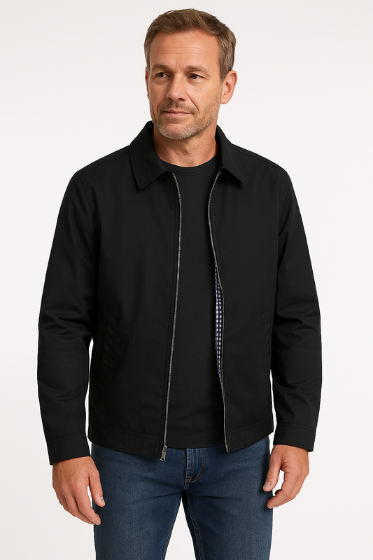 Man wearing a black jacket and blue jeans on a white background