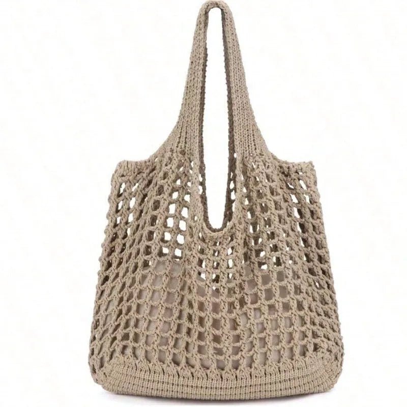 Beige crochet handbag on a white background