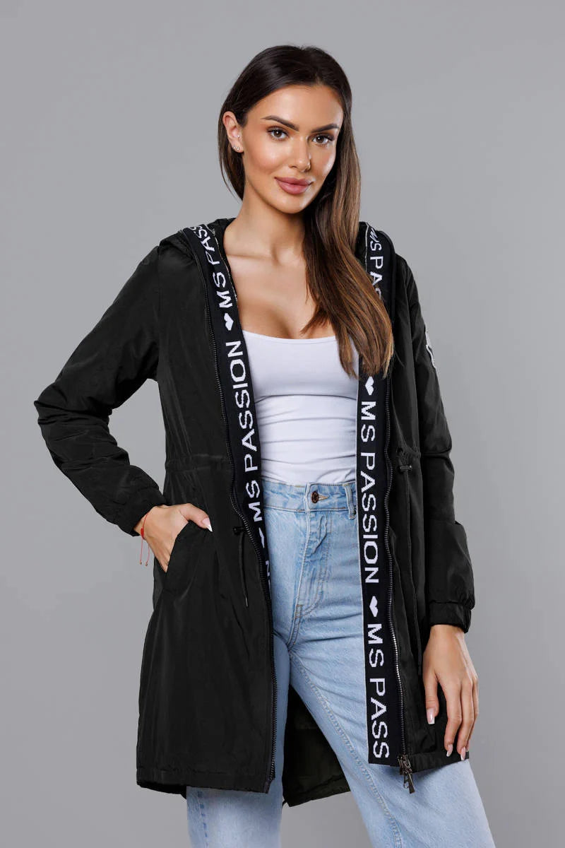 Woman wearing a black jacket with 'MS Passion' branding on a gray background