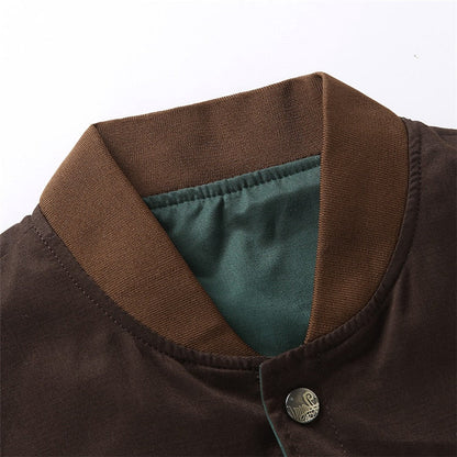 Close-up of a brown collar with a button on a garment, against a white background