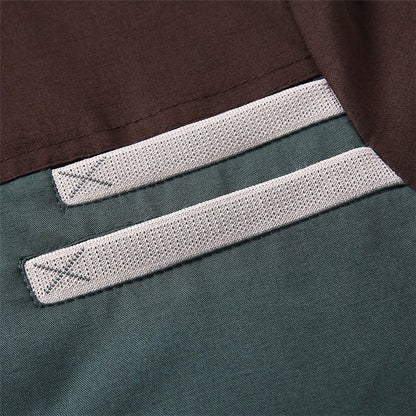 Close-up of a label on a piece of clothing with a brown and green background.