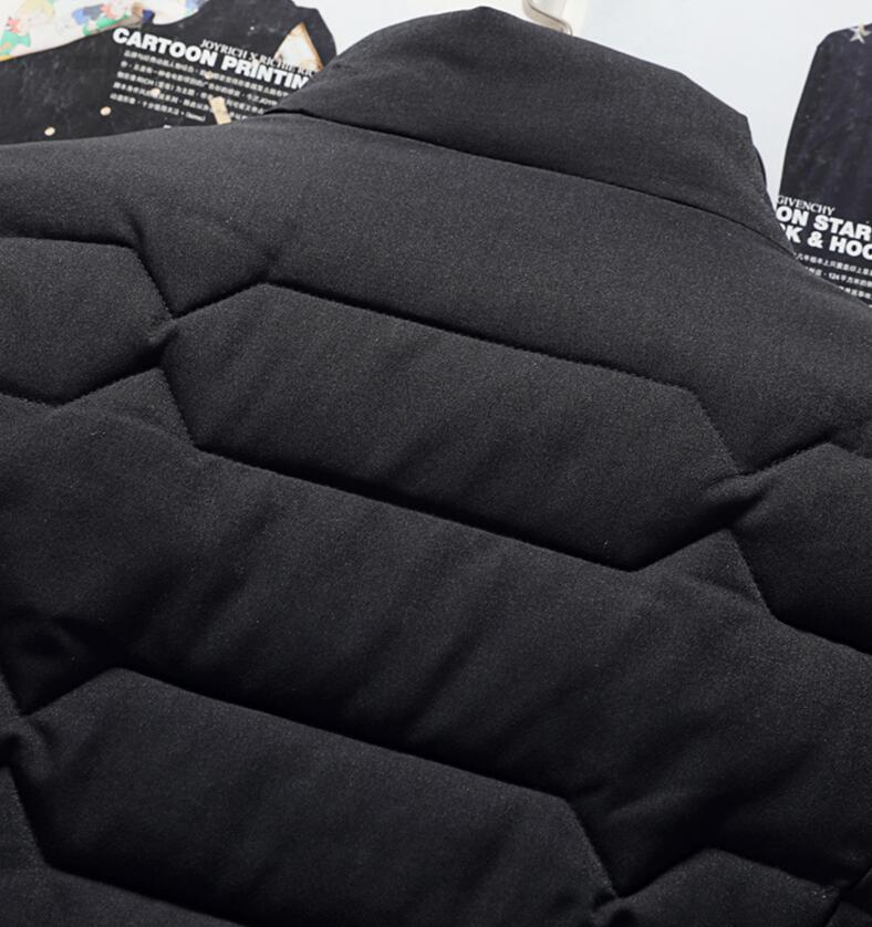 Black puffer jacket with visible stitching details