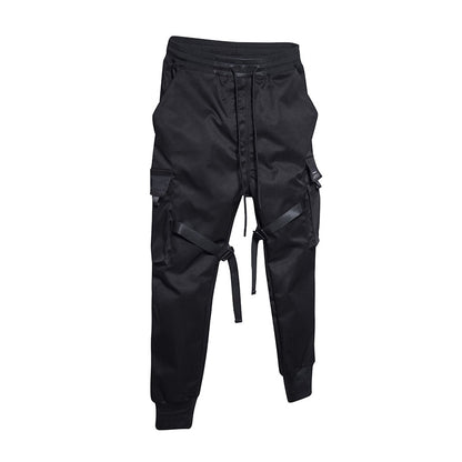Black cargo pants with multiple pockets on a white background