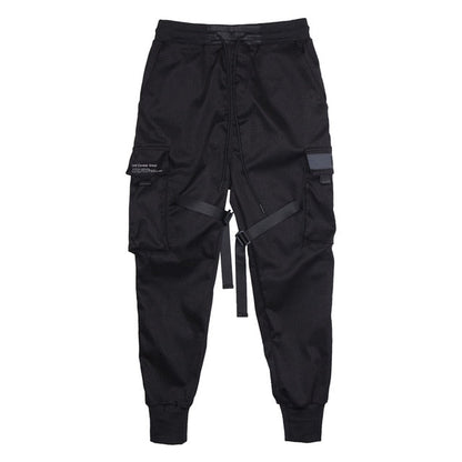 Black cargo pants with multiple pockets on a white background