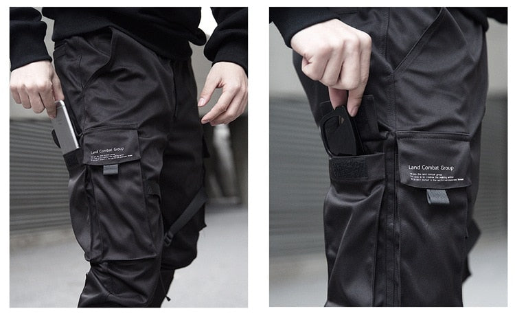 Black tactical pants with visible branding on a neutral background