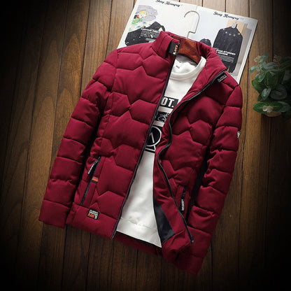 Red puffer jacket on a mannequin against a wooden background