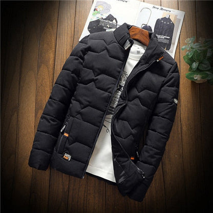 Black puffer jacket on a wooden surface with a magazine in the background