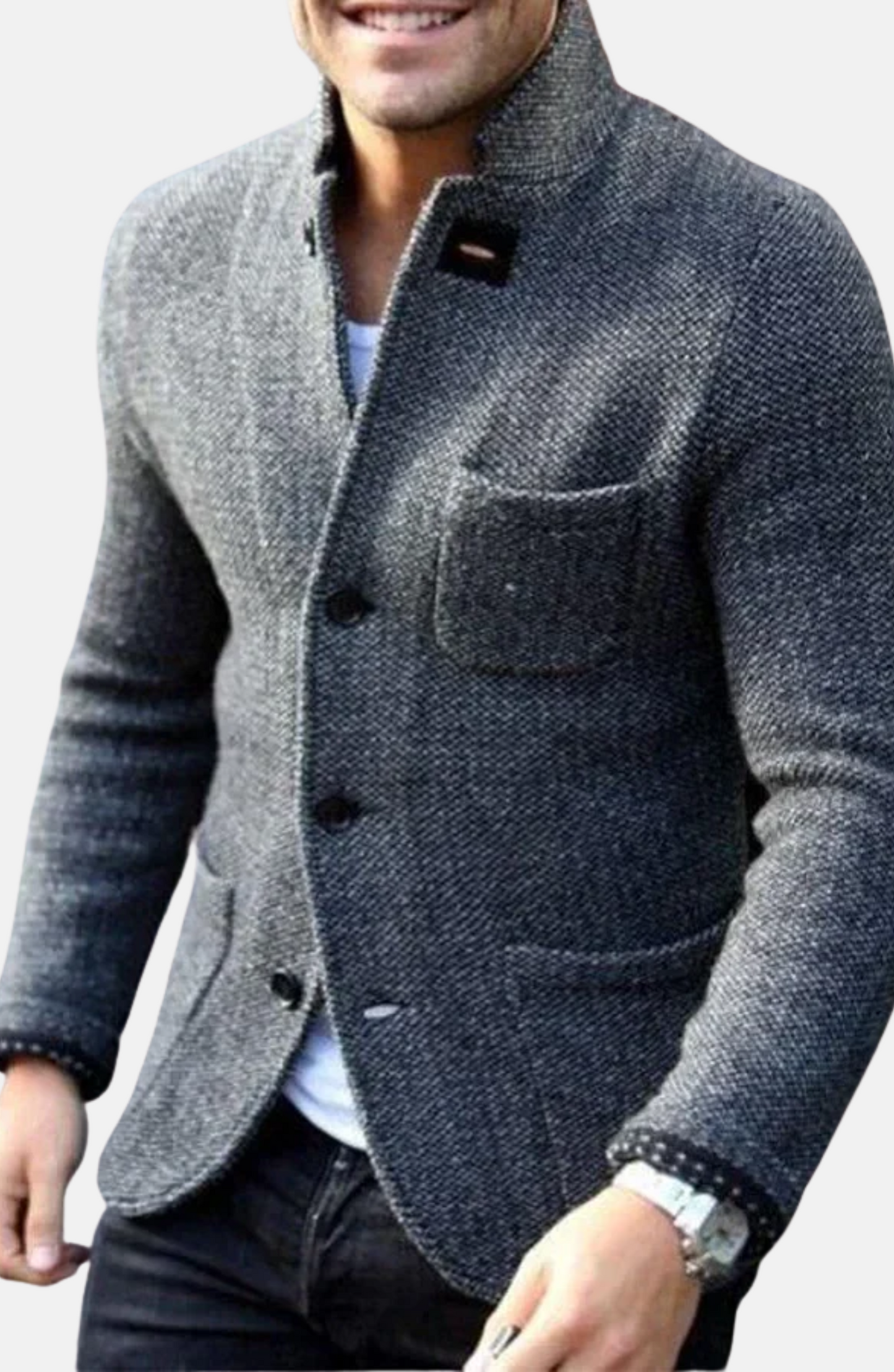 Man wearing a gray textured blazer with a plain background