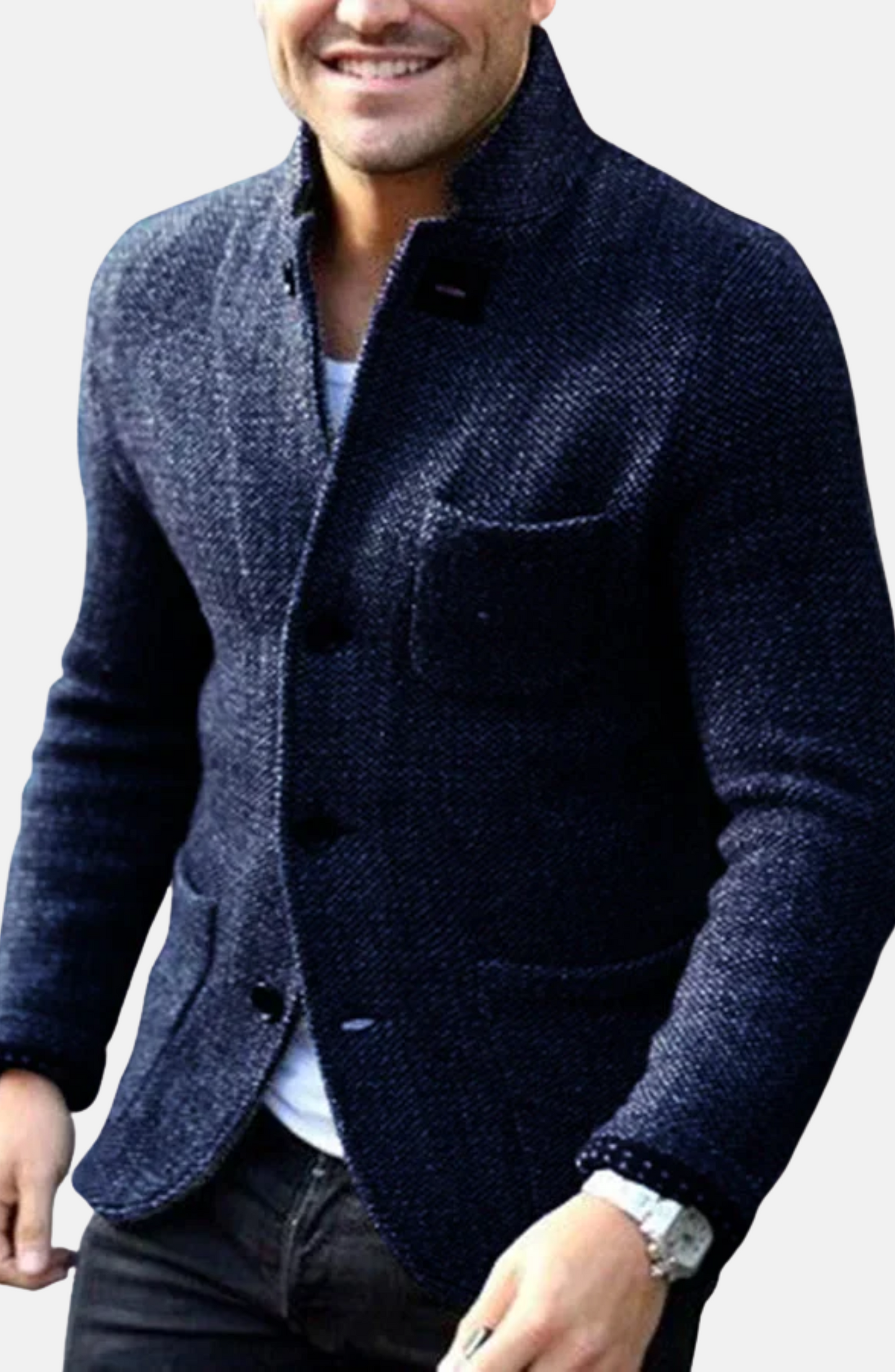 Man wearing a dark blue textured blazer with a light gray background