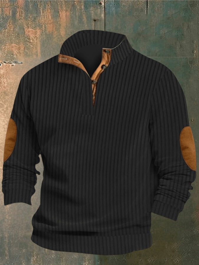 Black ribbed sweater with brown elbow patches on a textured background