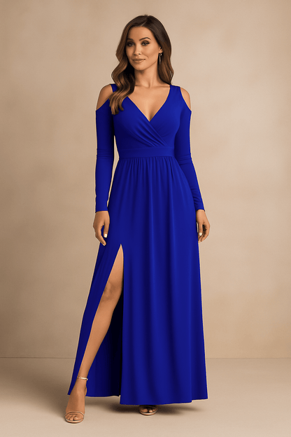Woman wearing a blue evening gown with a slit on a beige background