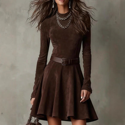 Brown dress with long sleeves and a belt on a plain background