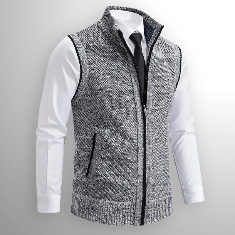 Gray knitted vest over a white shirt with a gray background