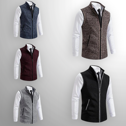 Five different vests worn over a white shirt on a gray background
