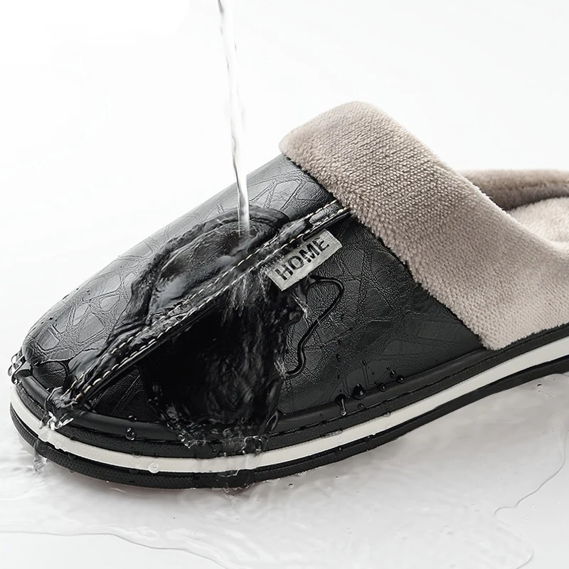 Black slipper with a visible brand label on a white background