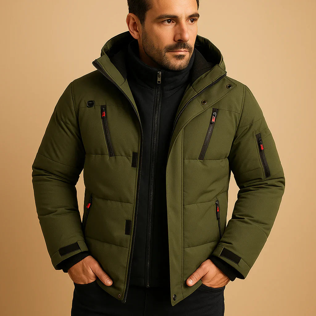 Man wearing a green winter jacket against a beige background