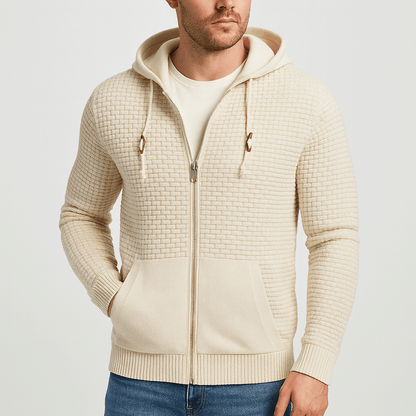 Man wearing a beige textured zip-up hoodie on a light gray background