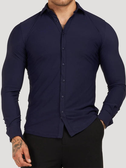 Navy blue button-up shirt worn by a person on a gray background