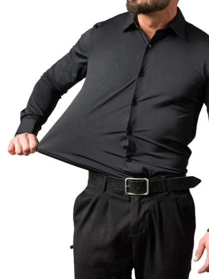 Man wearing a black dress shirt and pants on a white background