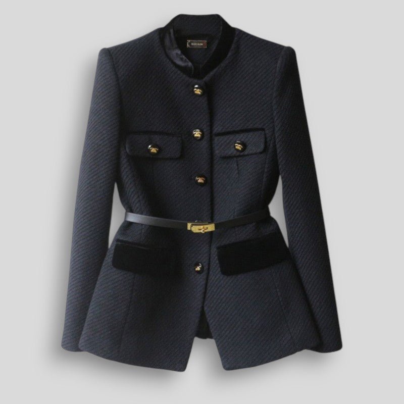 Navy blazer with gold buttons on a light gray background